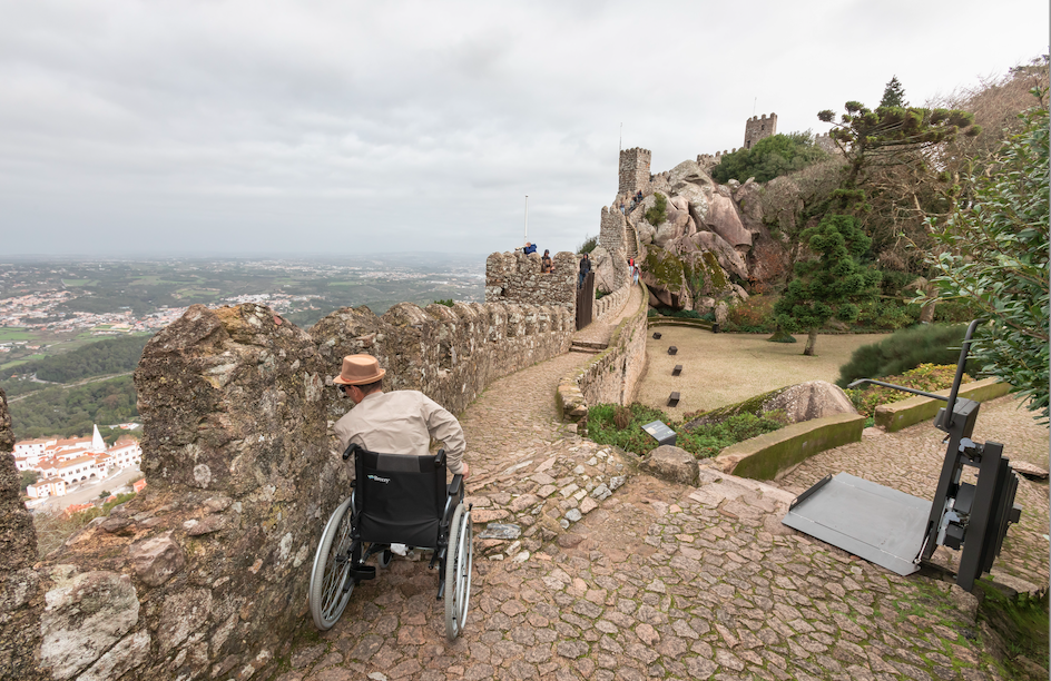 Vew from Sintra castle with wheelchair user looking over battlements 